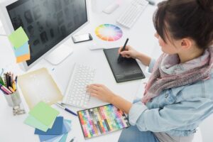 High,Angle,View,Of,An,Artist,Drawing,Something,On,Graphic